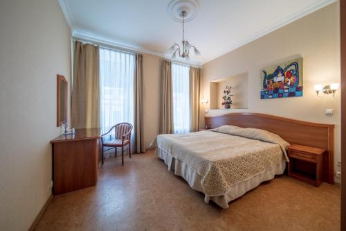Кровать или кровати в номере Отель Комфорт