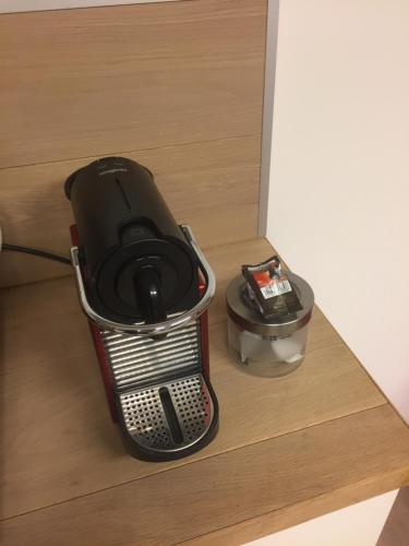 a gaming system sitting on top of a drawer at Studio Peralta in Liège