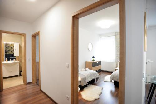 a bedroom with a mirror and a bed in a room at ONE Luxury Suites Eger in Eger