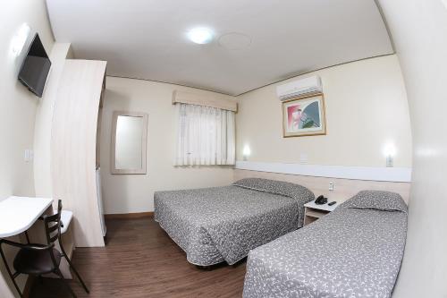En eller flere senge i et værelse på Hotel Express Centro Histórico