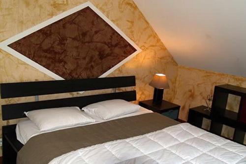 Un pat sau paturi într-o cameră la Hotel restaurant Robinson