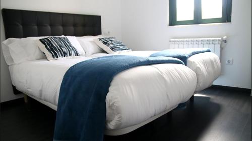 Katil atau katil-katil dalam bilik di Apartamentos AUGA
