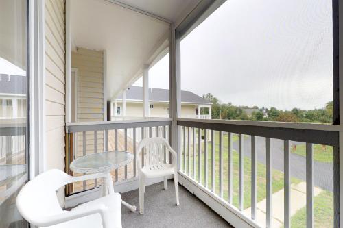 a balcony with a table and two chairs and a table at Wellington Manor in Wells