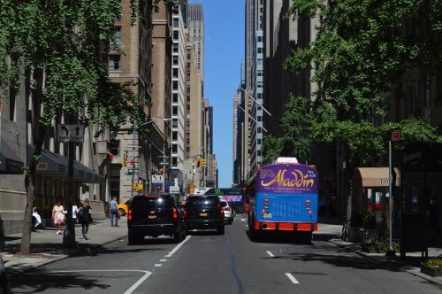 a group of cars driving down a city street at The Bayard in New York