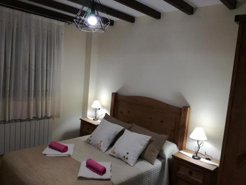 En eller flere senge i et værelse på Casa Rural Mirador del Valle
