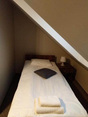 Una cama o camas en una habitación de Gościniec Oaza Sorkwity