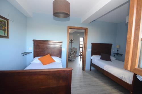 A bed or beds in a room at El Pajar de Lina