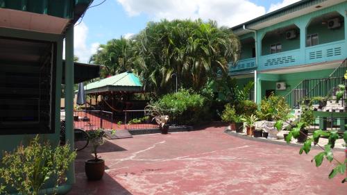 Taman di luar De Kolibrie Appartementen
