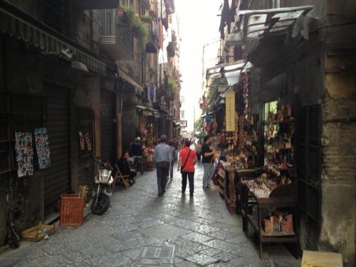 a group of people walking down a street at Casa Velata a Spaccanapoli in Naples