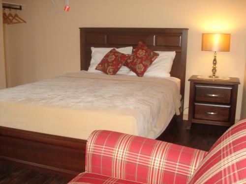 Кровать или кровати в номере Motel la Maison de Travers