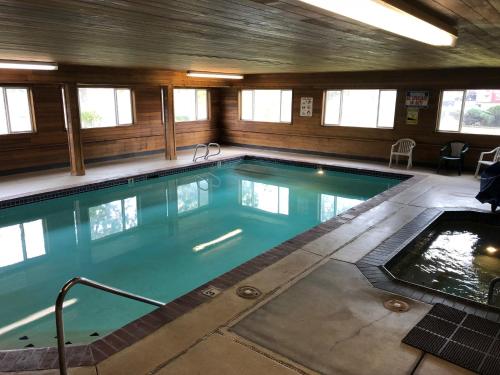 a large swimming pool in a building at Super 8 by Wyndham LaGrande in La Grande