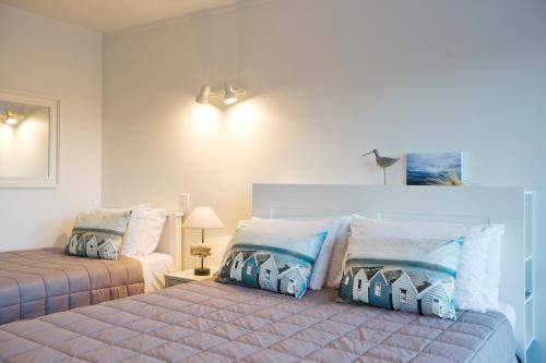 Postel nebo postele na pokoji v ubytování Motel Oasis