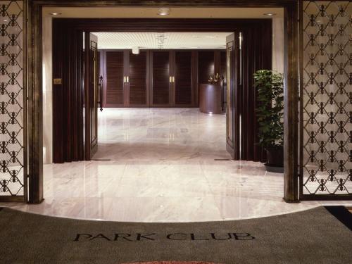 a hallway with a park club sign in the middle of a building at Sapporo Park Hotel in Sapporo