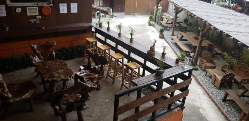 an overhead view of a restaurant with tables and chairs at Old Orangewood Bed & Breakfast in Baguio