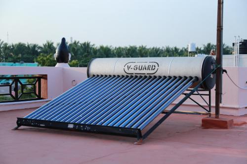 a metal bench sitting on top of a roof at Coimbatore Home Stay & Serviced Apartment in Coimbatore