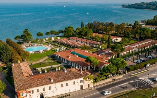 an aerial view of a resort with a swimming pool at Splendido Bay Luxury Spa Resort in Padenghe sul Garda