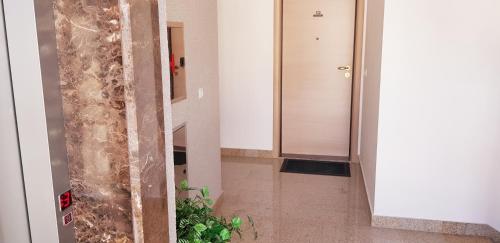 a hallway with a shower in a building at Pjerotic Apartment in Budva
