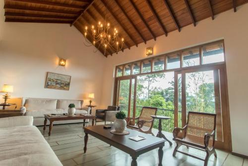 a living room with a couch and a table at Niketh Villa Kandy in Kandy