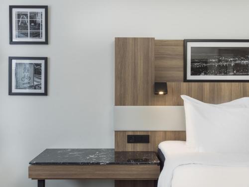 a hotel room with a bed and a desk at Radisson Blu Hotel Nydalen, Oslo in Oslo