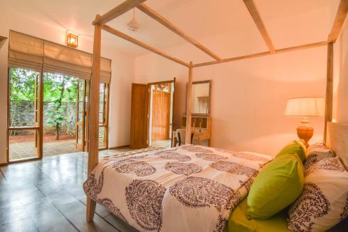 Ένα ή περισσότερα κρεβάτια σε δωμάτιο στο Niketh Villa Kandy