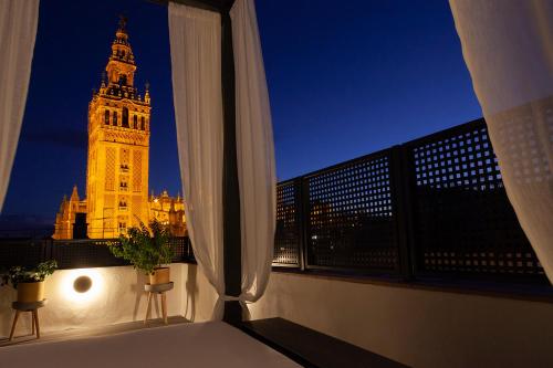 a view of the big ben clock tower from a balcony at Welldone Cathedral in Seville