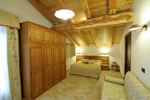 Postel nebo postele na pokoji v ubytování Hotel Villa Plinia