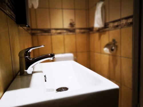 a bathroom sink with a faucet on top of it at Best Western Plaza Hotel in Eskilstuna