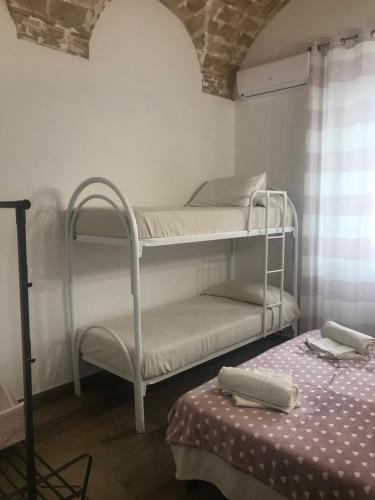 Ένα ή περισσότερα κρεβάτια σε δωμάτιο στο Il Torrione