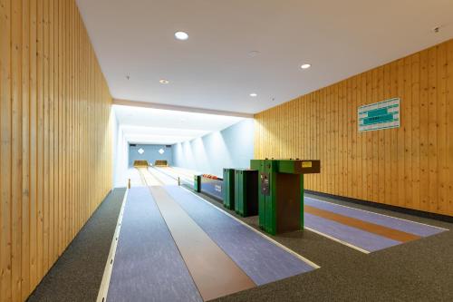a hallway with wooden walls and a bowling alley at Wilhelm-Kempf-Haus in Wiesbaden