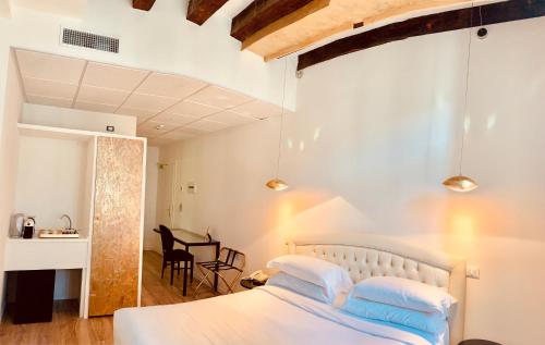 Кровать или кровати в номере Palazzo Otello 1847 Wellness & Spa