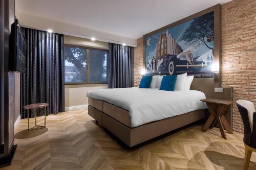 Postel nebo postele na pokoji v ubytování Grand Hotel Valies