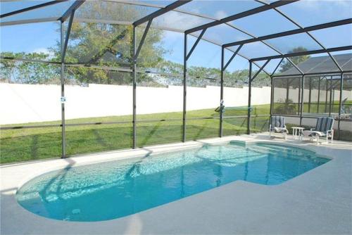 a large swimming pool with a pavilion in a house at Orlando Discount Villas - Davenport in Davenport