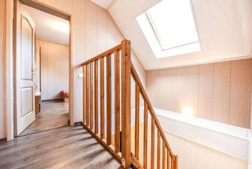 a skylight in a house with a stairway at Vacation Home Mezsargi in Pape