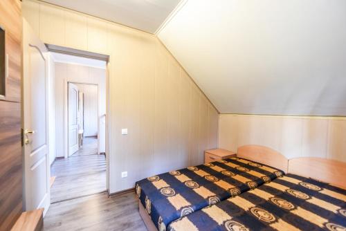 a bedroom with a bed in a room at Vacation Home Mezsargi in Pape