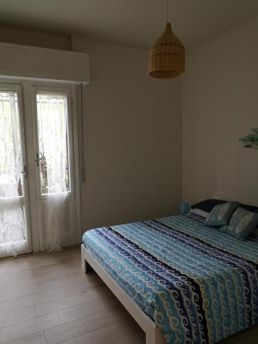 Ένα ή περισσότερα κρεβάτια σε δωμάτιο στο Casa Patri