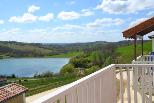 a view of a lake from a house at Résidence L'Oustal Del Carlat in Carla-Bayle