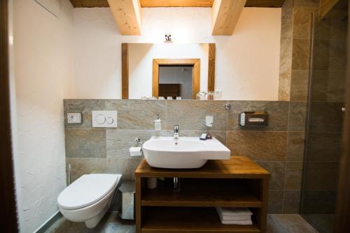 a bathroom with a sink and a toilet at Challet Jasná Exclusive **** in Belá