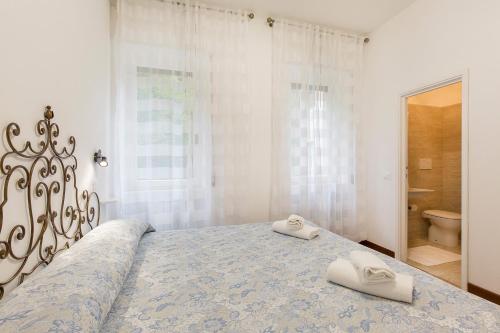Posteľ alebo postele v izbe v ubytovaní Rampolina view by Impero House