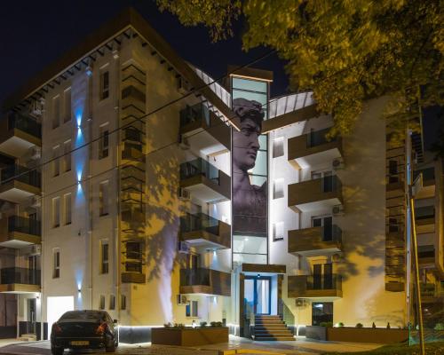 a building with a bust of a woman on the side at Bella Roe Premium Apartments in Belgrade
