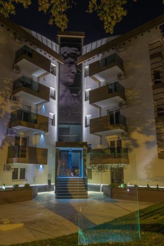a building with a large mural on the side of it at Bella Roe Premium Apartments in Belgrade