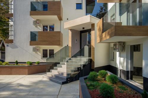 a building with stairs on the side of it at Bella Roe Premium Apartments in Belgrade