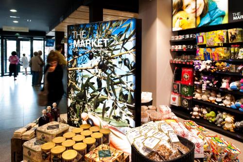 a woman standing in a store with a display of products at AS Hoteles Altube in Zuia