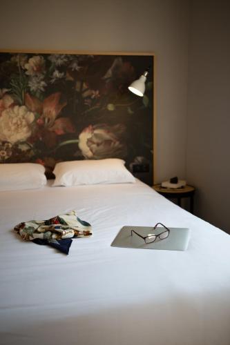 Un ou plusieurs lits dans un hébergement de l'établissement Hôtel Edmond W Lyon Part-Dieu