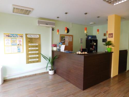a restaurant with a counter in a room at Darius HSTL in Sunny Beach