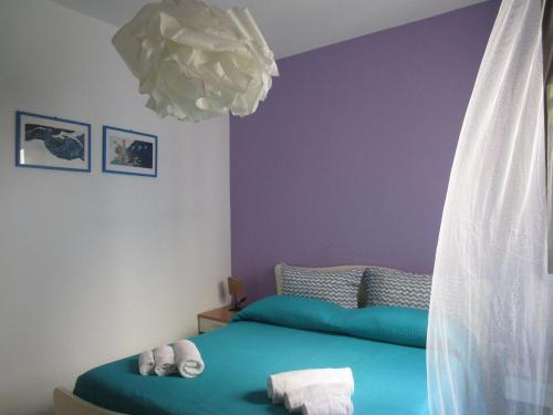 Un pat sau paturi într-o cameră la Il volo di Pindaro