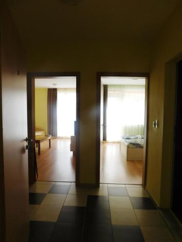 a room with two doors and a room with a bed at Darius HSTL in Sunny Beach