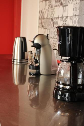 a counter with a blender and other appliances on it at The Holy Rock - Hostel at meteora in Kalabaka