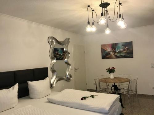 Letto o letti in una camera di Park-Residenz Isernhagen