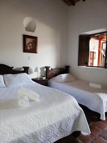 Ένα ή περισσότερα κρεβάτια σε δωμάτιο στο Hotel Casa Claustro De Zapatoca