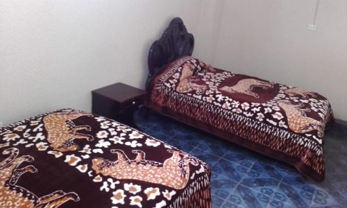 Cama o camas de una habitación en Hostal Lesly Salome